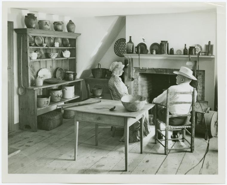[Woman and man sit in Walt Whitman farmhouse kitchen], Digital ID 1636029, New York Public Library