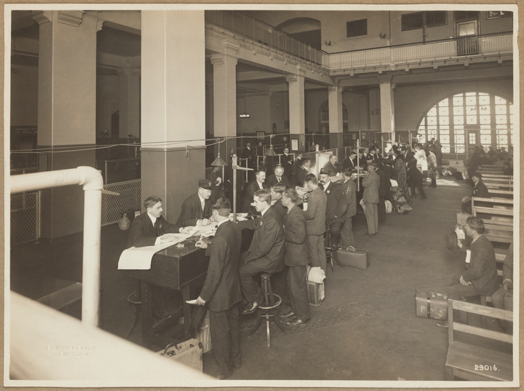 Immigrants being registered at one end of the Main Hall, U. S. Immigration Station., Digital ID 1693105, New York Public Library