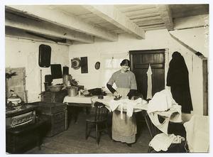 Farmer’s wife, ironing in kitc... Digital ID: 93948. New York Public Library