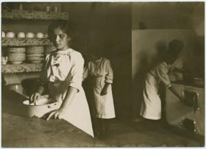 [Kitchen scene. Young woman in... Digital ID: 1536557. New York Public Library