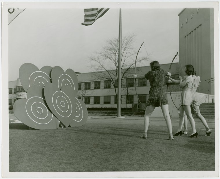 Sports - Archery - Group of women aiming at heart shaped targets