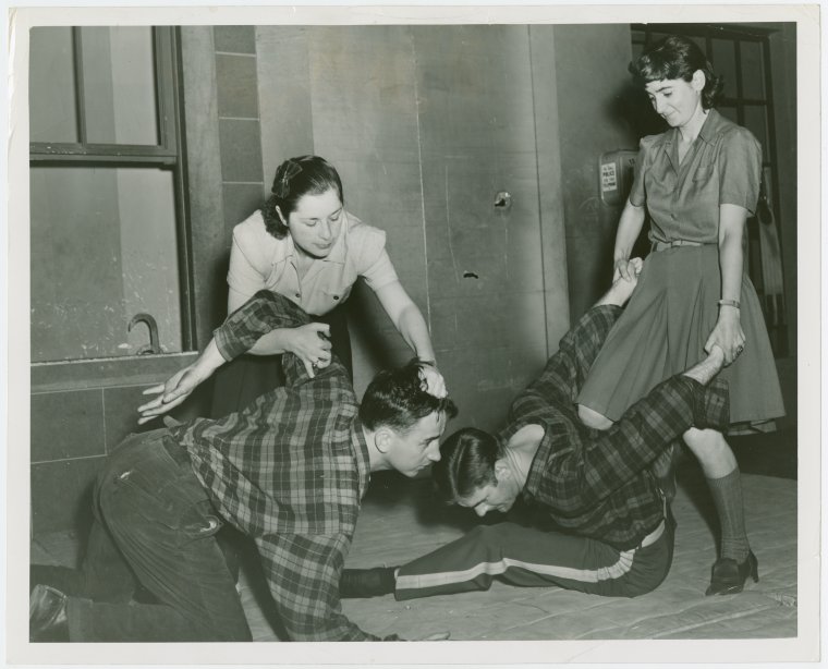 Sports - Self-Defense - Women demonstrating how to hold men down