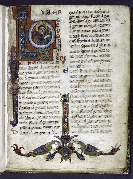 Large opening initial with angel of Matthew. Border design with animals -  NYPL Digital Collections