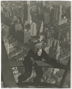 A worker hanging on to two ste... Digital ID: 79839. New York Public Library