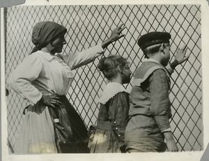 A woman, a boy and a girl at a... Digital ID: 79885. New York Public Library