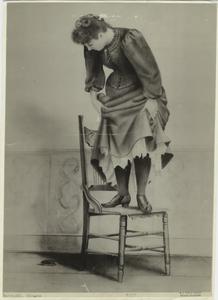[Woman standing on chair to av... Digital ID: 823270. New York Public Library