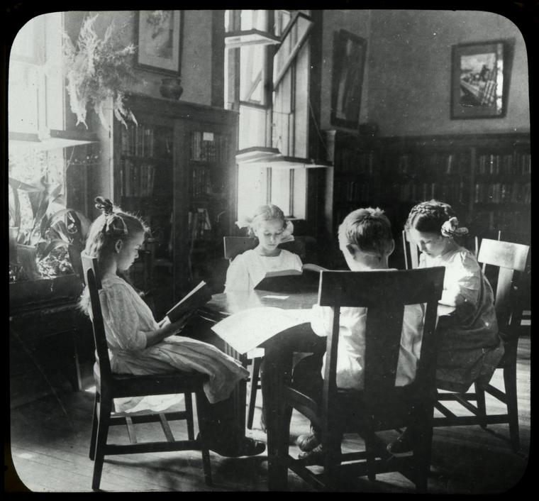 Riverside, girls sitting in a circle by a sunny window, plants nearby, Digital ID 100863, New York Public Library