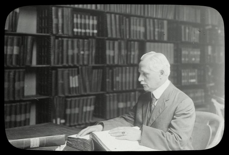 Library for the Blind, Alfred Zaiss, Salesman of paper and twine, lost sight at 17, reading in room 116, June 1914., Digital ID 106142, New York Public Library