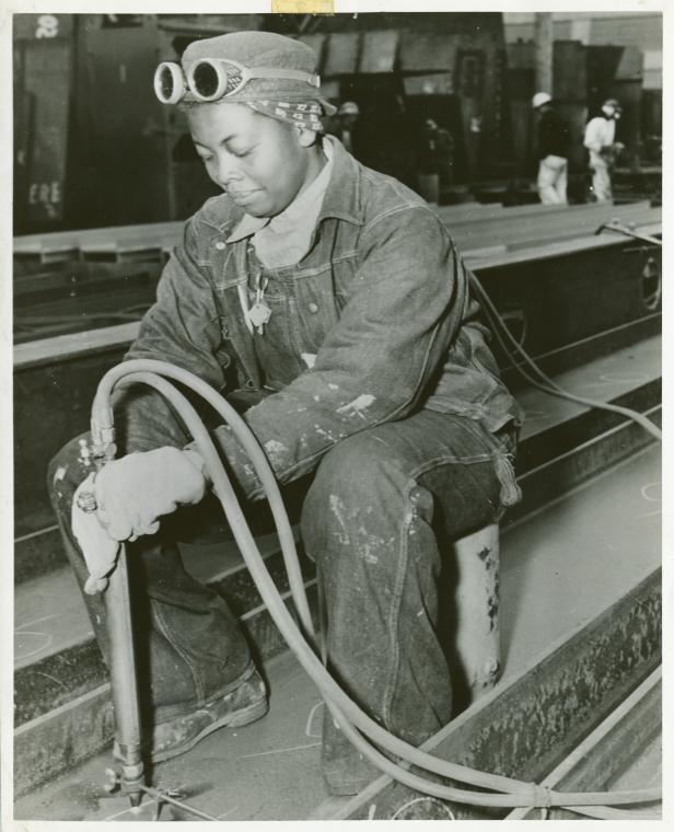 [Miss Anna Bland, an African American woman, working on the SS George Washington Carver, April 1943.],Rushing the SS George Washington Carver to completion., Digital ID 1260356, New York Public Library