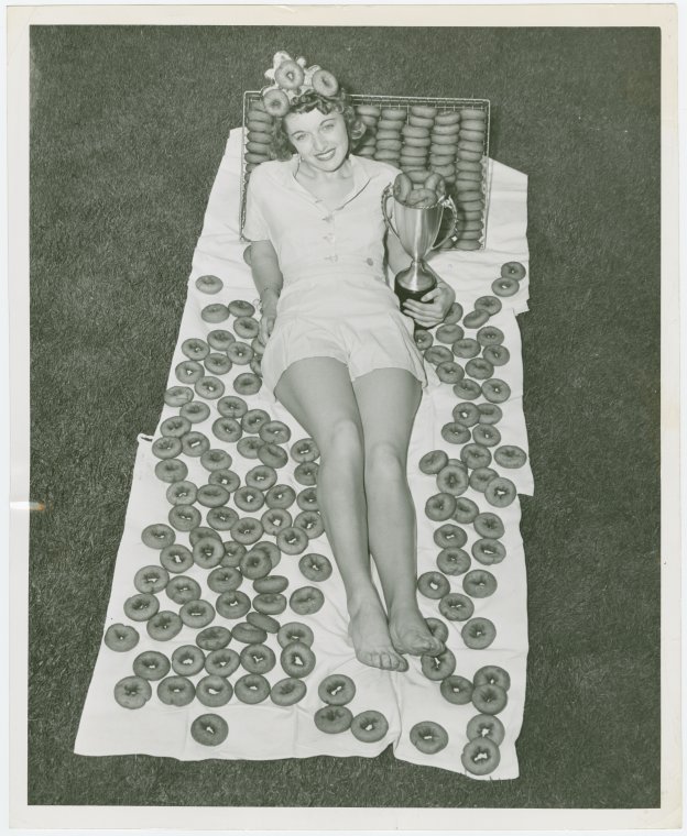 Florida Participation - Girl with doughnuts and trophy, Digital ID 1673079, New York Public Library