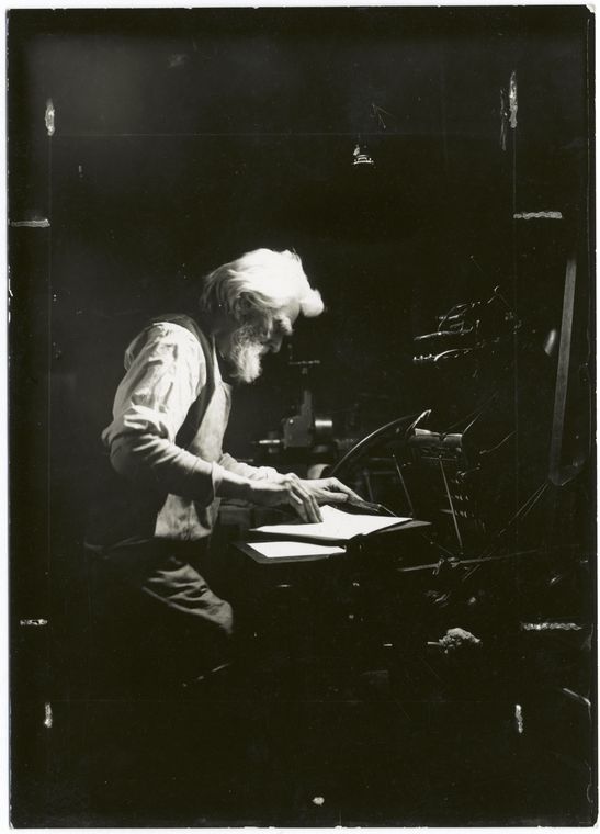 Old time craftsman printer using the old type of foot press, Digital ID 416506, New York Public Library