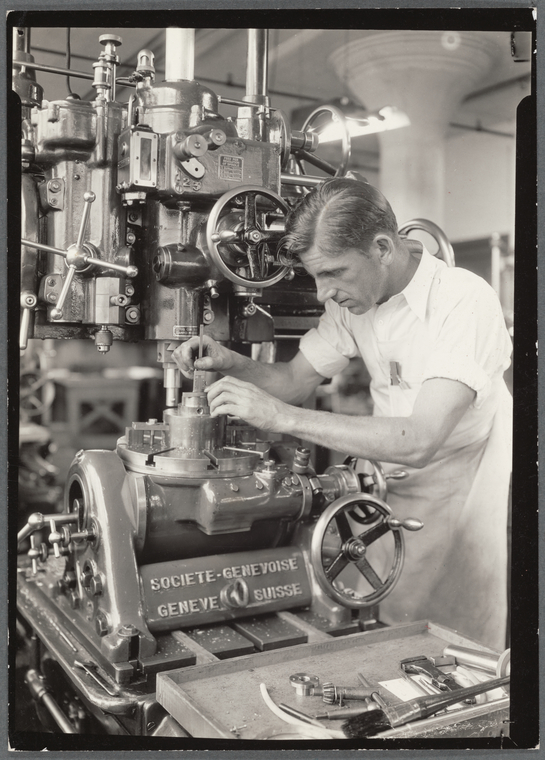 Precision mechanic using depth gauge on a metal boring, Digital ID 416542, New York Public Library