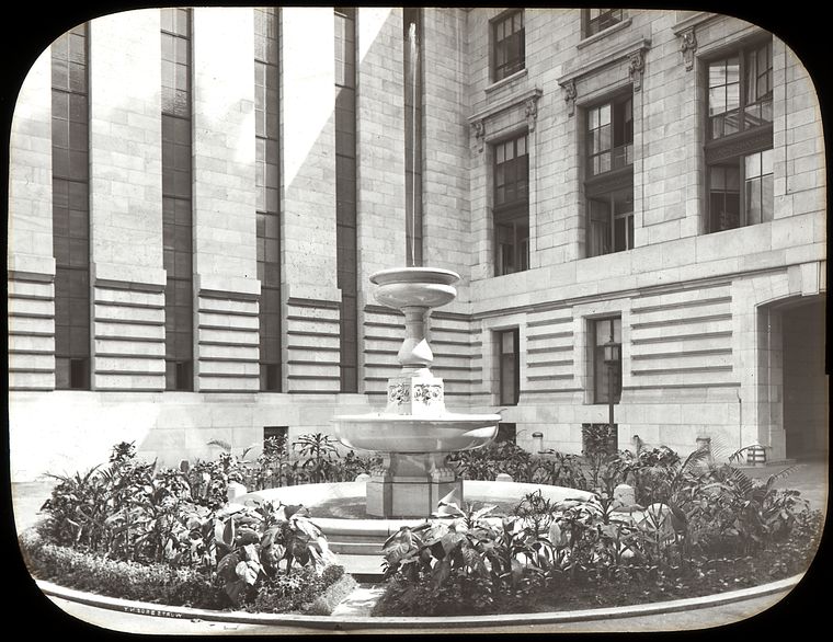  interior court, midsummer 1912, showing fountain in center of court surrounded by plants., Digital ID 465497, New York Public Library