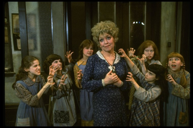  swope_212026 Actress Dorothy Loudon as Miss Hannigan (C) surrounded by orphans incl. Danielle Brisebois (2L) in a scene from the Broa... (1977)