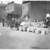 Chicago YMCA, Clean-up Campaign. [Young children pulling baskets with cans through the streets.]