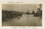 Postcard of adults being baptized in the Ohio River in Louisville, Kentucky.