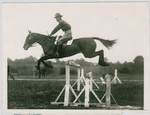 An Army officer demonstrating jumping with a cavalry remount