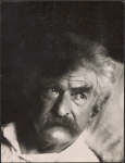 Mark Twain in bed.
