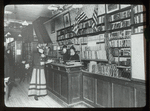 Aguilar F.C.L., 113 E. 59th Street Br., Delivery desk, wire enclosure, flags overhead