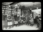 Aguilar F. C. L., 624 #. 5th St., Children in line at application desk