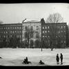 Winter in Harlem, boys sleighing in front of library building