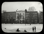 Winter in Harlem, boys sleighing in front of library building