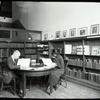 Music Library, Man and woman reading in "small room"