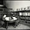Music Library, Man and woman reading in "small room"