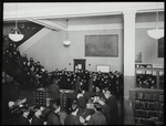 96th Street, Adult room, 1923, showing people at desk, and stairway filled with people