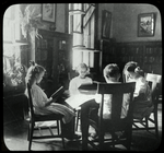 Riverside, girls sitting in a circle by a sunny window, plants nearby