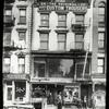 Rivington Street, neighborhood Guild Library, 26 Delancey Street, in two windows to left of fire escape, 3rd floor