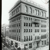 Rivington Street, University Settlement Building Library in 4 windows to right of doorway, second floor.  Present Riv. Branch in picture, 184 Eldridge Street