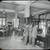 Seward Park interior views, young men at reference desk, closed shelves
