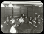 Seward Park, woman sitting and reading to others, Women's Club
