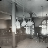 67th Street, men reading, man and woman by desk