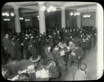 Tremont, interior views, a January evening,  showing readers filling tables and standing in line