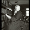 Webster: Interior views, Bohemian reader, woman in long dark dress, white scarf