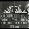 Webster: Interior views, Webster Free Circulating Library staff, overlooking collection of music and arts