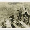 American boys making bows and arrows