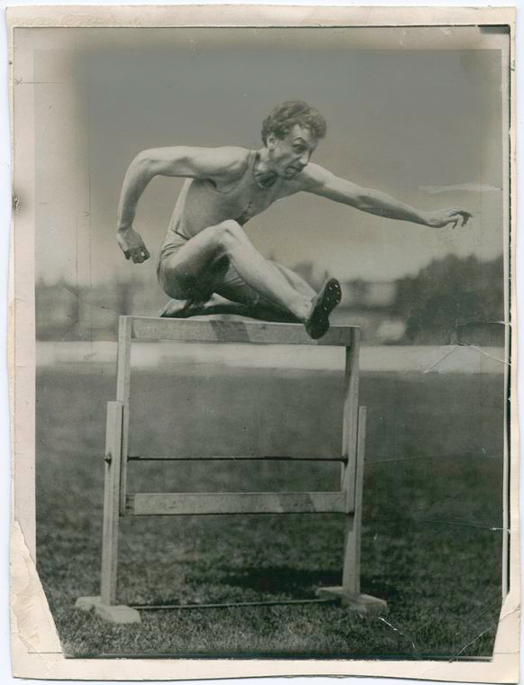 Alvin Kraenzlein jumping over a hurdle