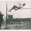 Harold M. Osborn clearing the bar in the running high jump.