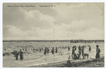 Bathing Scene, New Dorp Beach, Staten Island, N.Y.  [people bathing, long pier off beach.]