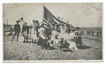 Midland Beach Staten Island. [people in old-fashioned garb on sand holding large American flag as well as small flags.]