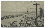 Midland Beach, looking South, Staten Island, N.Y. [people on boardwalk and beach, old telephone poles.]