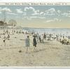 Sun and Water Bathing, Midland Beach, Staten Island, N.Y.  [people on beach, buildings and ferris wheel in distance.]