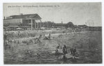 On the Float, Midland Beach, Staten Island, N.Y.  [people on float in water, buildings on shore, ferris wheel in distance.]