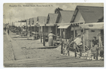 Bungalow City, Midland Beach, Staten Island, N.Y.  [people and children outside of cottage row.]