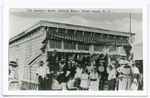 The Souvenir Booth, Midland Beach, Staten Island, N.Y. [repro] [people standing in front of concession stand.]
