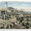 Boardwalk and Beach, South Beach, Staten Island, N.Y. [people on beach with buildings on boardwalk, --tuts Tavern, Loutpa (Greek letters), Liberty Baths Bathing, umbrellas advertising what appears to be Bloomingdales.]