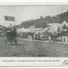 The Midway Richmond County Fair, Staten Island  (Concession Stands, people walking about, stadium and Painless Parker's cart  in middle of road.